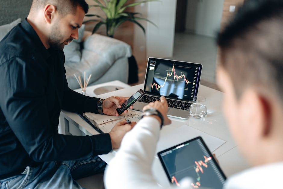 Image of a businessman analyzing reviews on a laptop